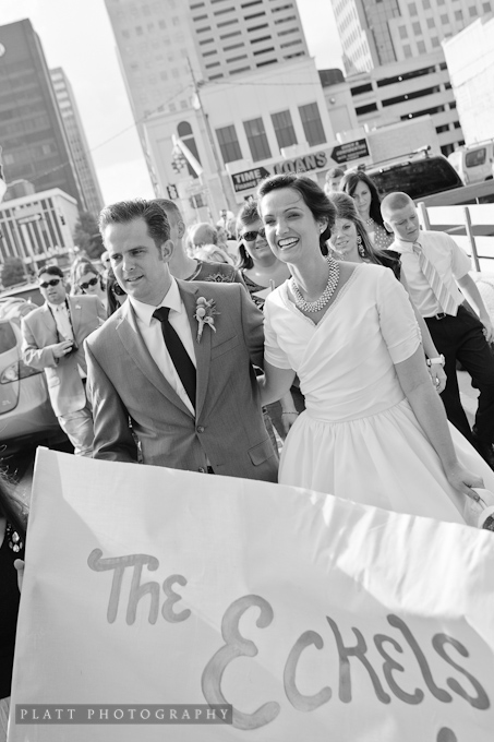 bride and groom at the head of the Second Line Parade for the Wedding Reception
